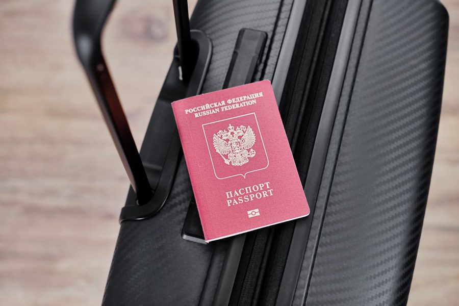 russian-passport-black-travel-suitcase-top-view-selective-background-emigration-russians-seeking-asylum-2